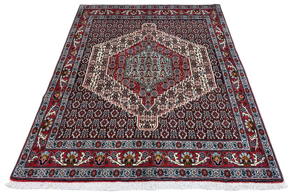 Hamadan rug with a large central pattern, surrounding border, and flat-woven edge