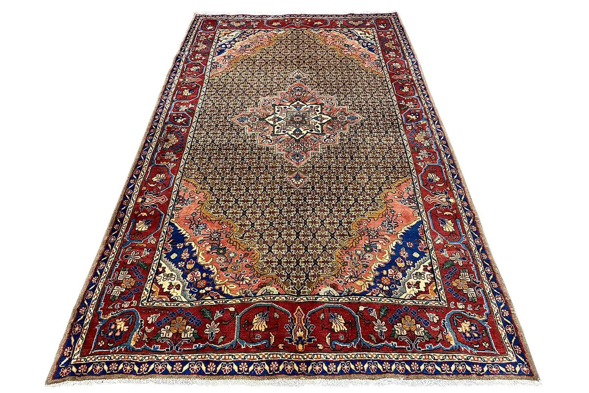 Rectangular oriental rug with a delicate ornamental pattern in brown, red, and blue