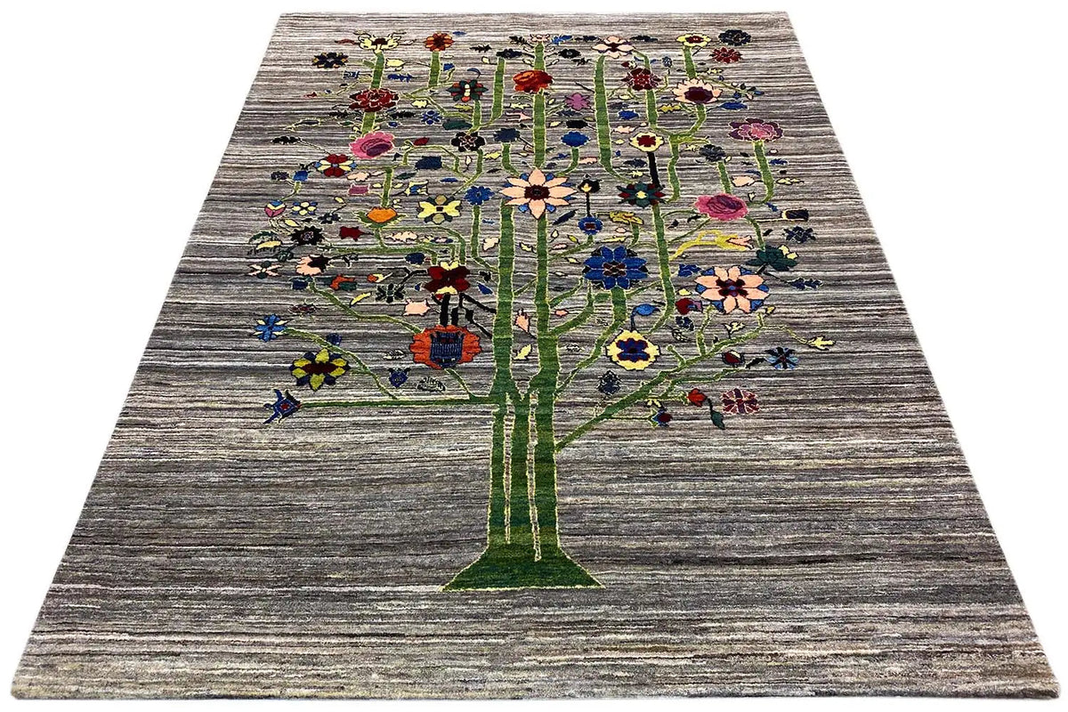 Gabbeh-Lori rug with a large tree motif on a gray background, viewed from above