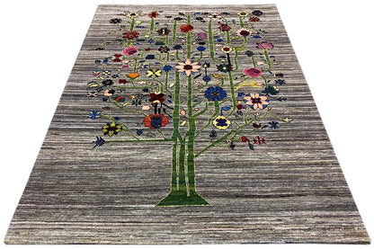 Gabbeh-Lori rug with a large tree motif on a gray background, viewed from above