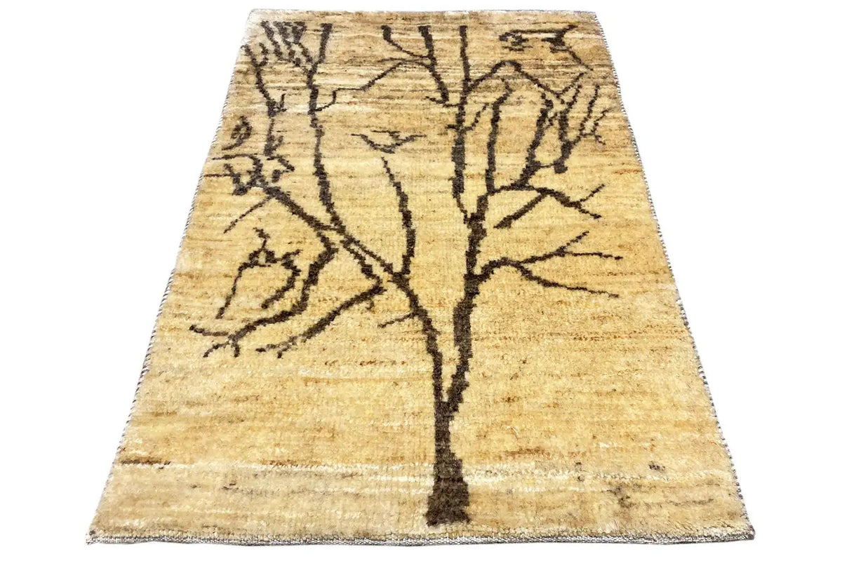 Gabbeh Lori rug with a beige background and black linear branch pattern