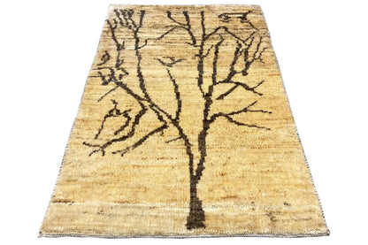 Gabbeh Lori rug with a beige background and black linear branch pattern