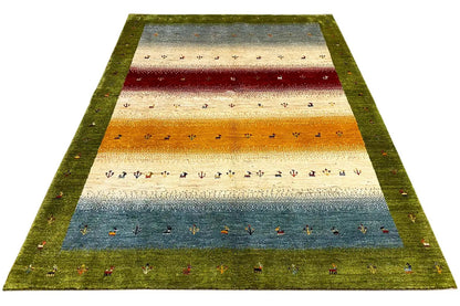 Gabbeh-Lori rug, edged in green with horizontal stripes in blue, red, and orange.