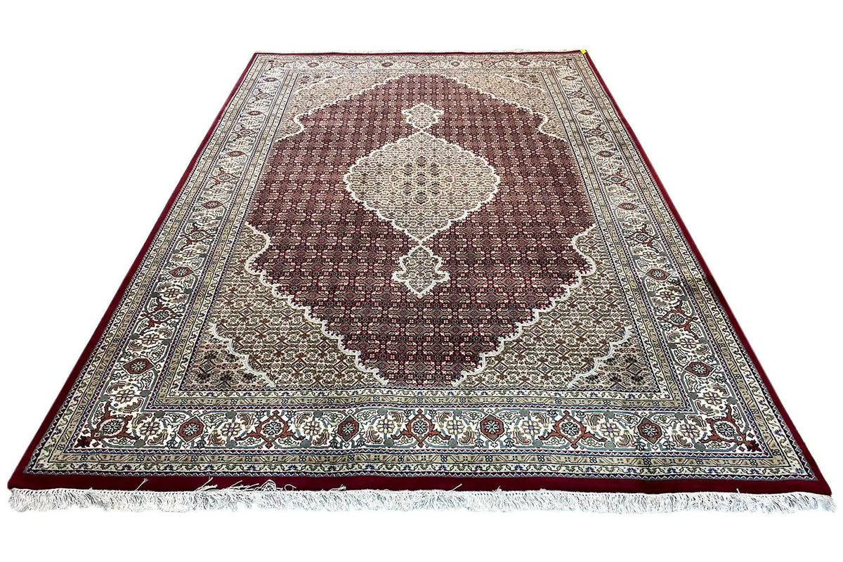 Indo-Tabriz carpet, laid out, large brown medallion in a beige border