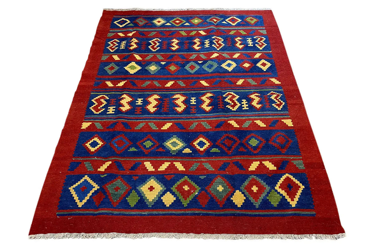 Red and blue kilim rug with rows of geometric motifs