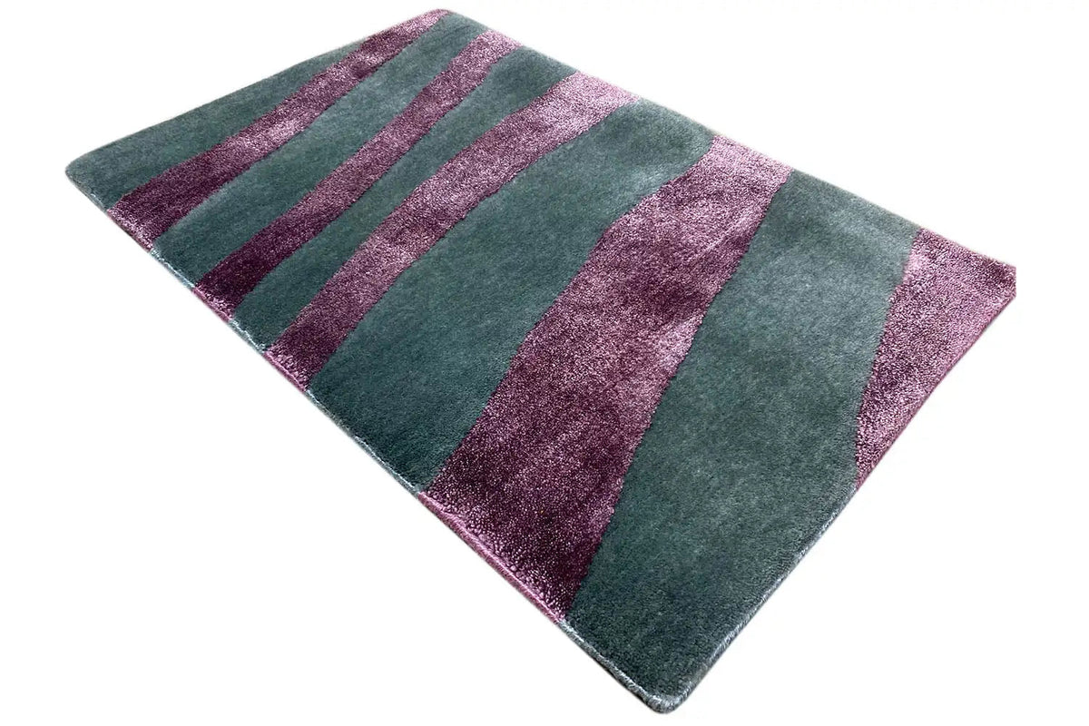 Rug with teal-green and purple stripes, slightly twisted