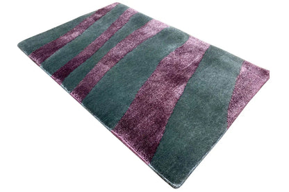 Rug with teal-green and purple stripes, slightly twisted