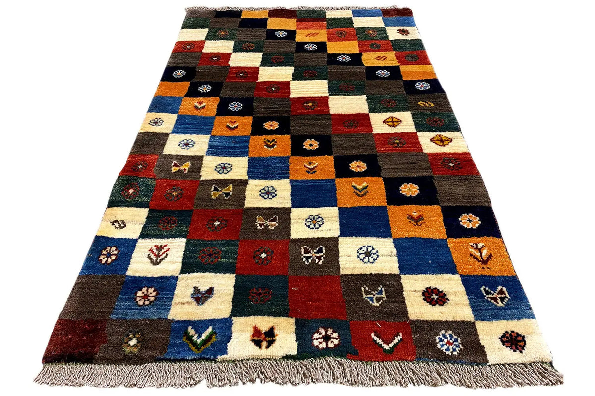 Gabbeh-Lori rug in an A-view with patchwork motifs and fringes along the edge