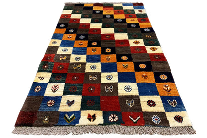 Gabbeh-Lori rug in an A-view with patchwork motifs and fringes along the edge