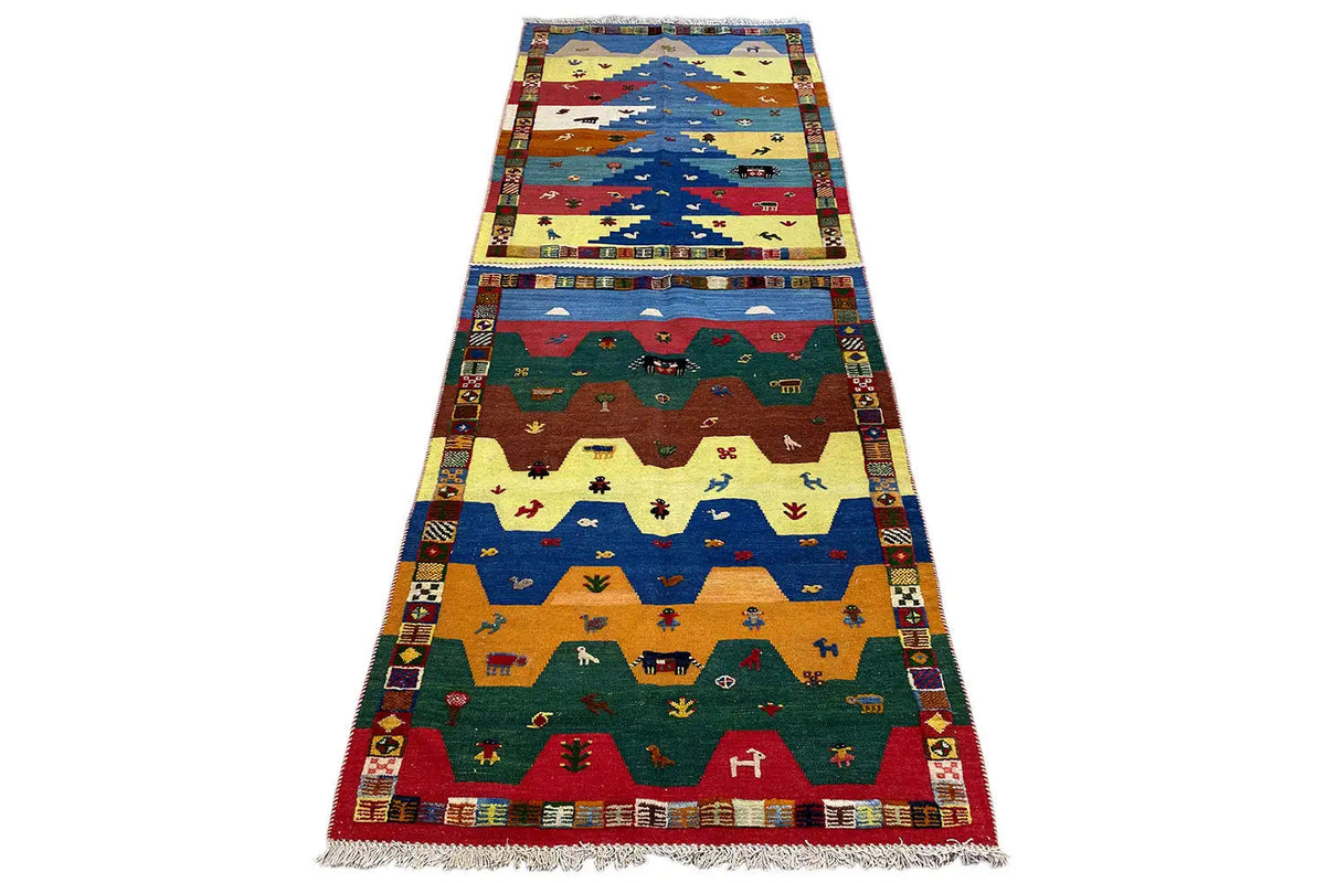 Long kilim runner with landscape and animal motifs, broad color blocks
