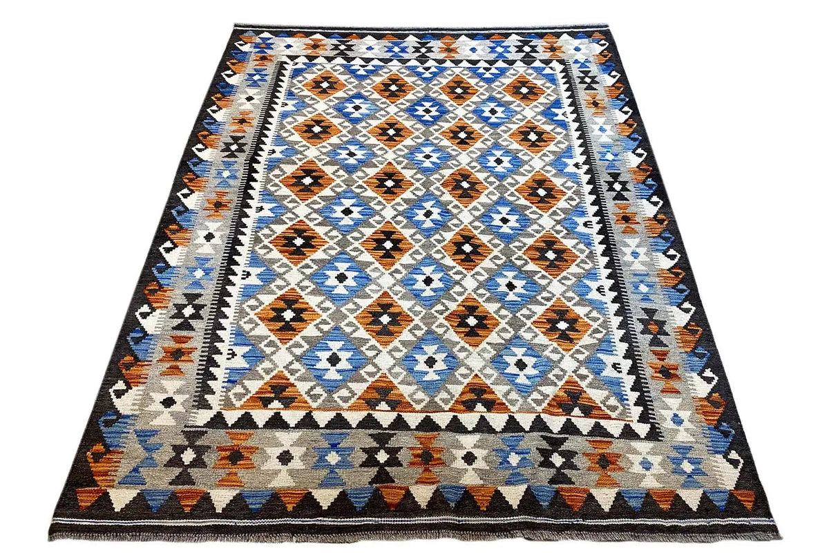Rectangular Afghan kilim rug with border friezes and a blue-and-white diamond pattern