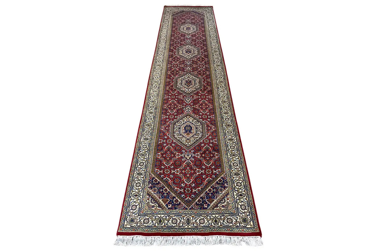 Bidjar runner rug with a red central area and ornamental border, fringe at the bottom