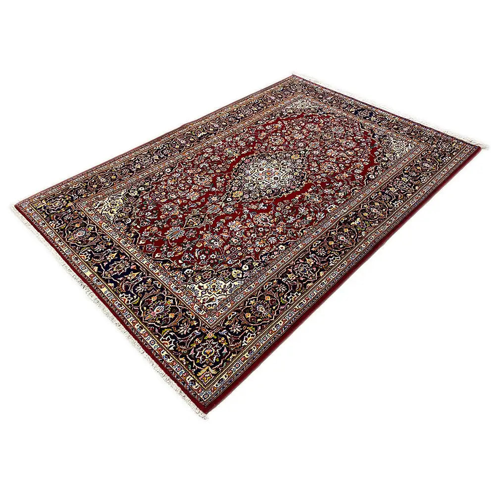 Keshan rug with a geometric central medallion and dark border, top view
