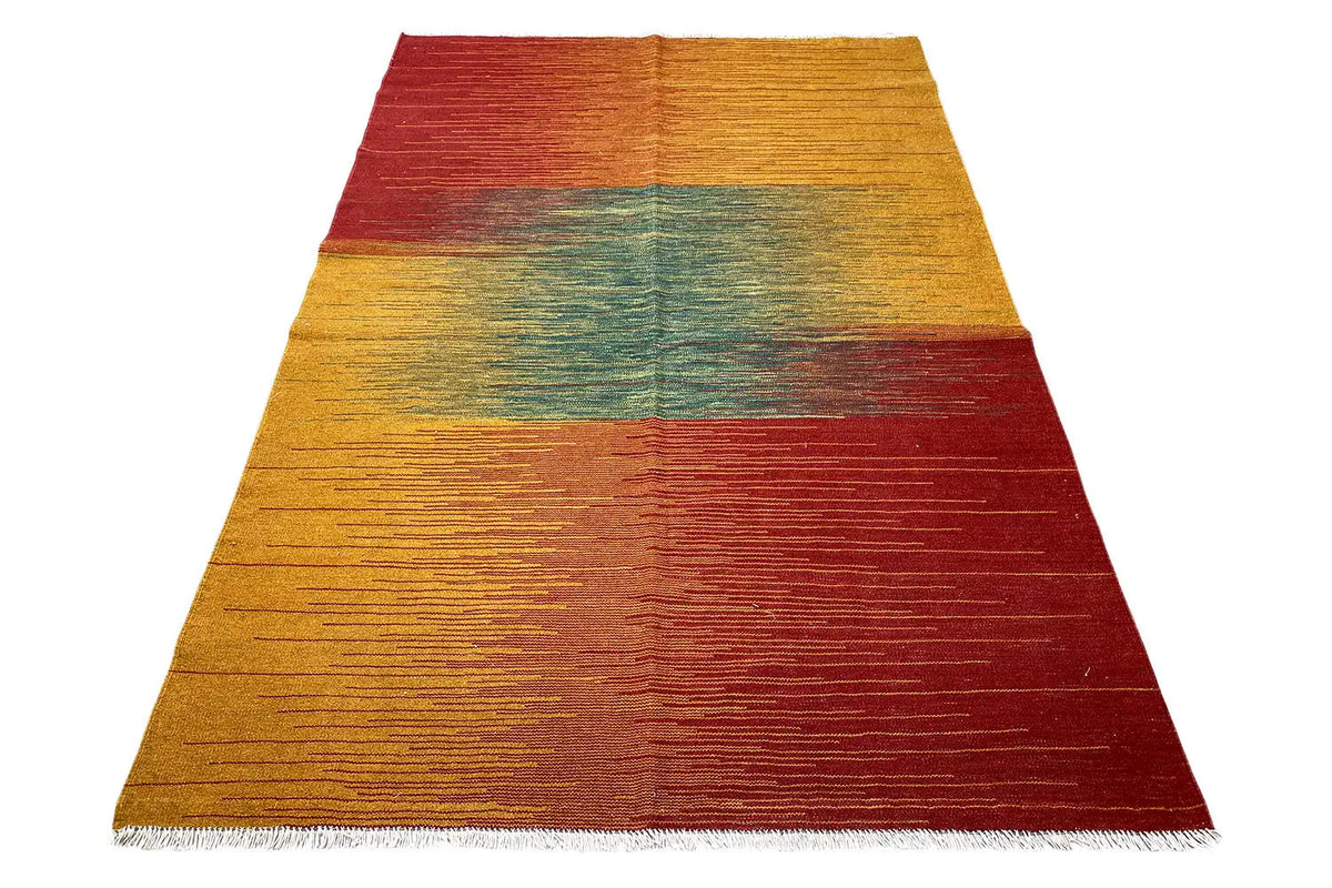Kilim rug in honey yellow, teal, and burgundy with clean lines and bound edges