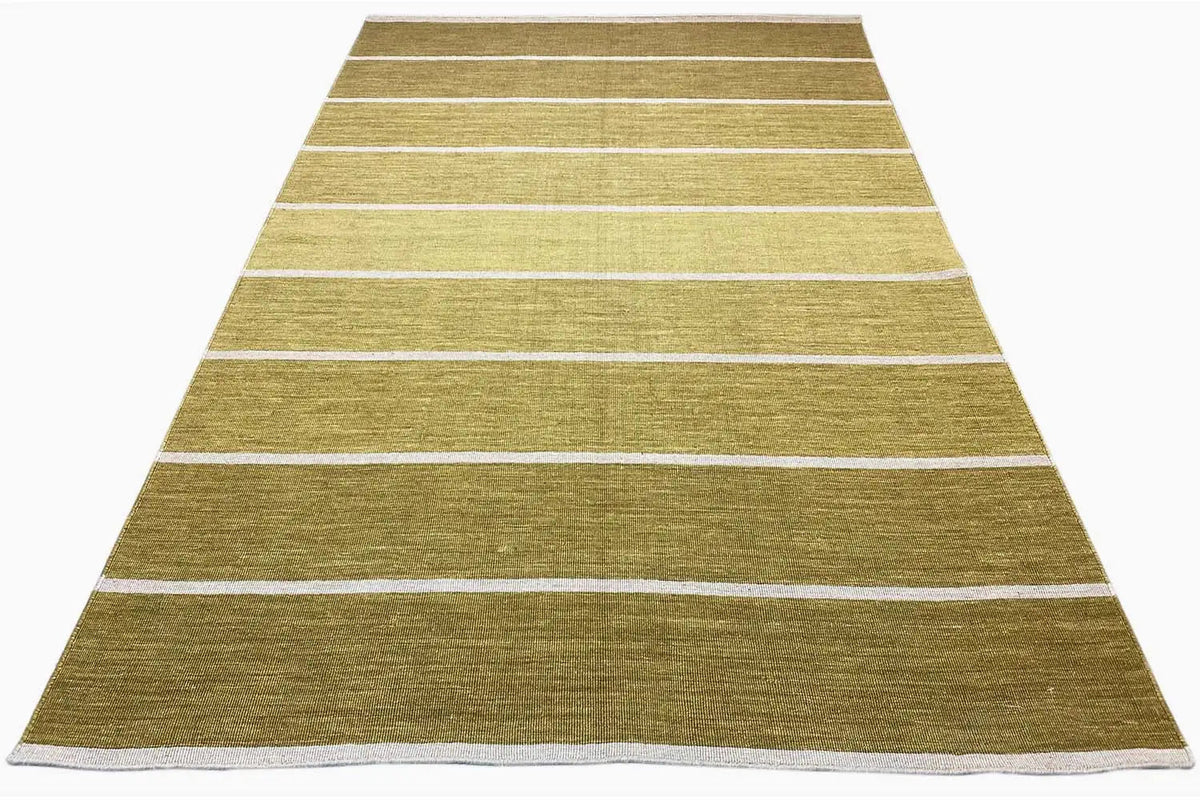 Rectangular kilim rug with white-bordered stripes in ochre green