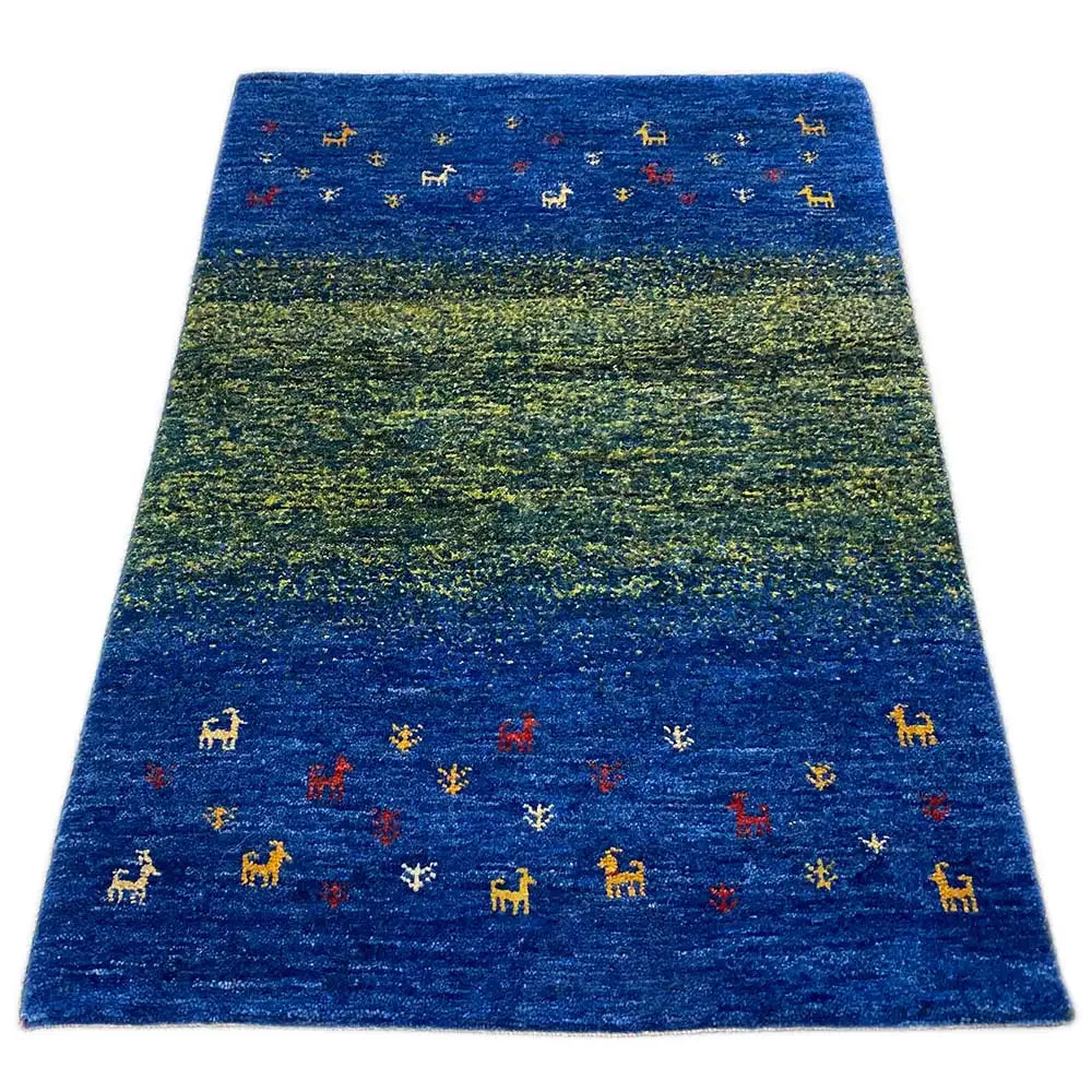 Gabbeh rug with blue-green color gradients and small animal motifs