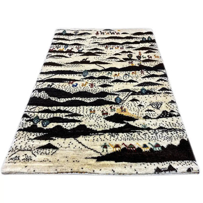Gabbeh rug with a striped pattern in cream, black, and colorful accents