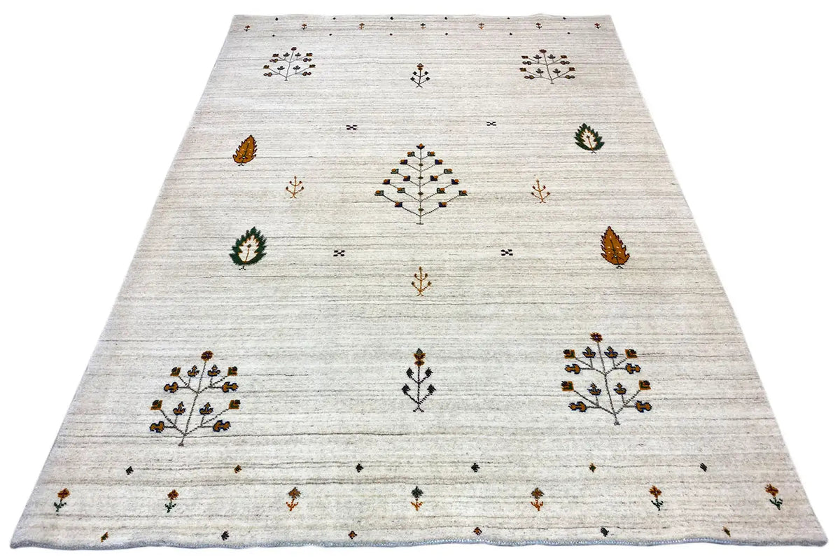 Light beige rug with a central star-floral pattern and small surrounding ornaments