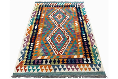 Afghan kilim with a diamond pattern, multicolored geometric design, and fringe along the edge