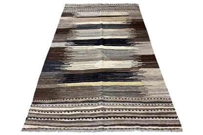 Kilim rug with graphic horizontal stripes in gray, brown, and cream, flat-woven