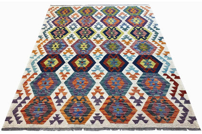 Afghan kilim rug in a triangular view with colorful tile patterns