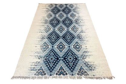 Kelim dhurrie rug, appearing triangular in shape, blue pattern in the center, with fringes