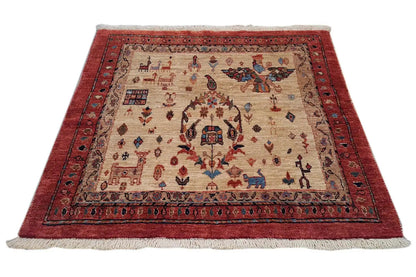 Classic rectangular Oriental rug with a beige background and red border, centered pattern.