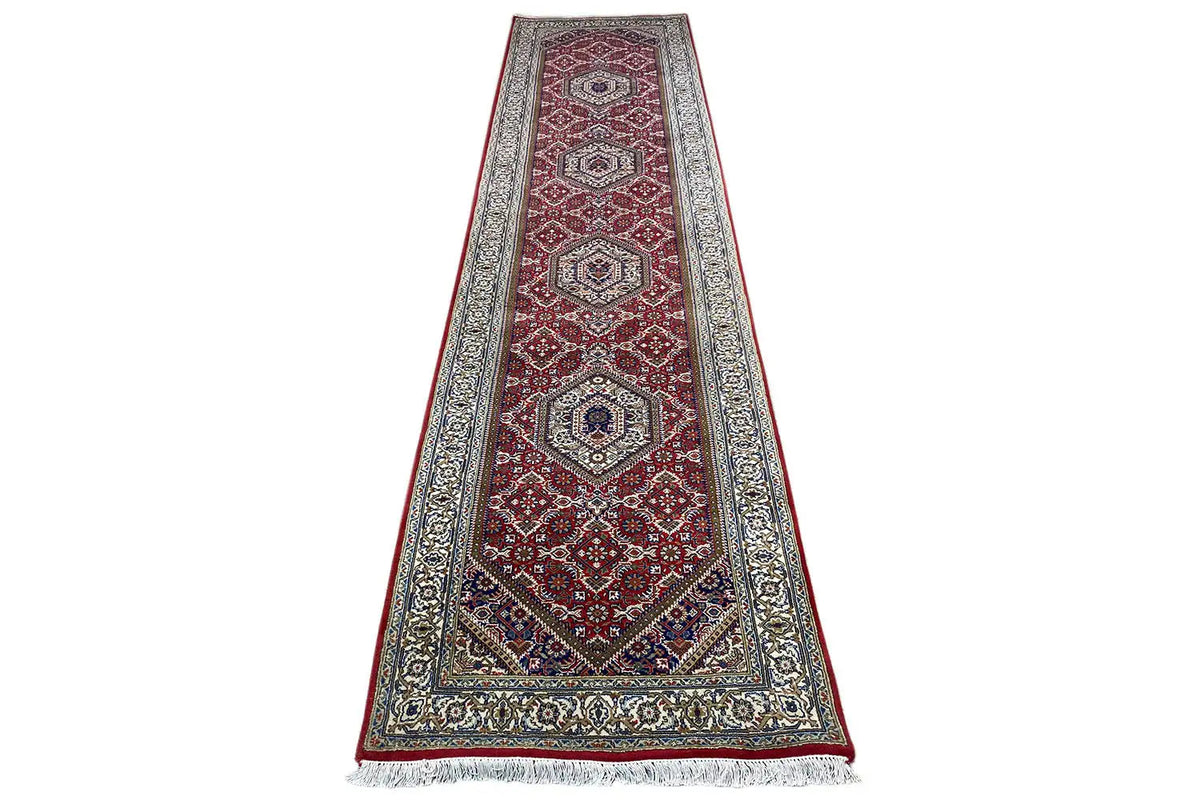 Bidjar runner with an oriental diamond pattern in burgundy and beige, front view