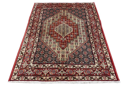 Rectangular rug with a red border, a light central medallion, and a diamond pattern