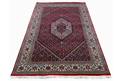 Bordeaux rug with a gray border and white fringed edge