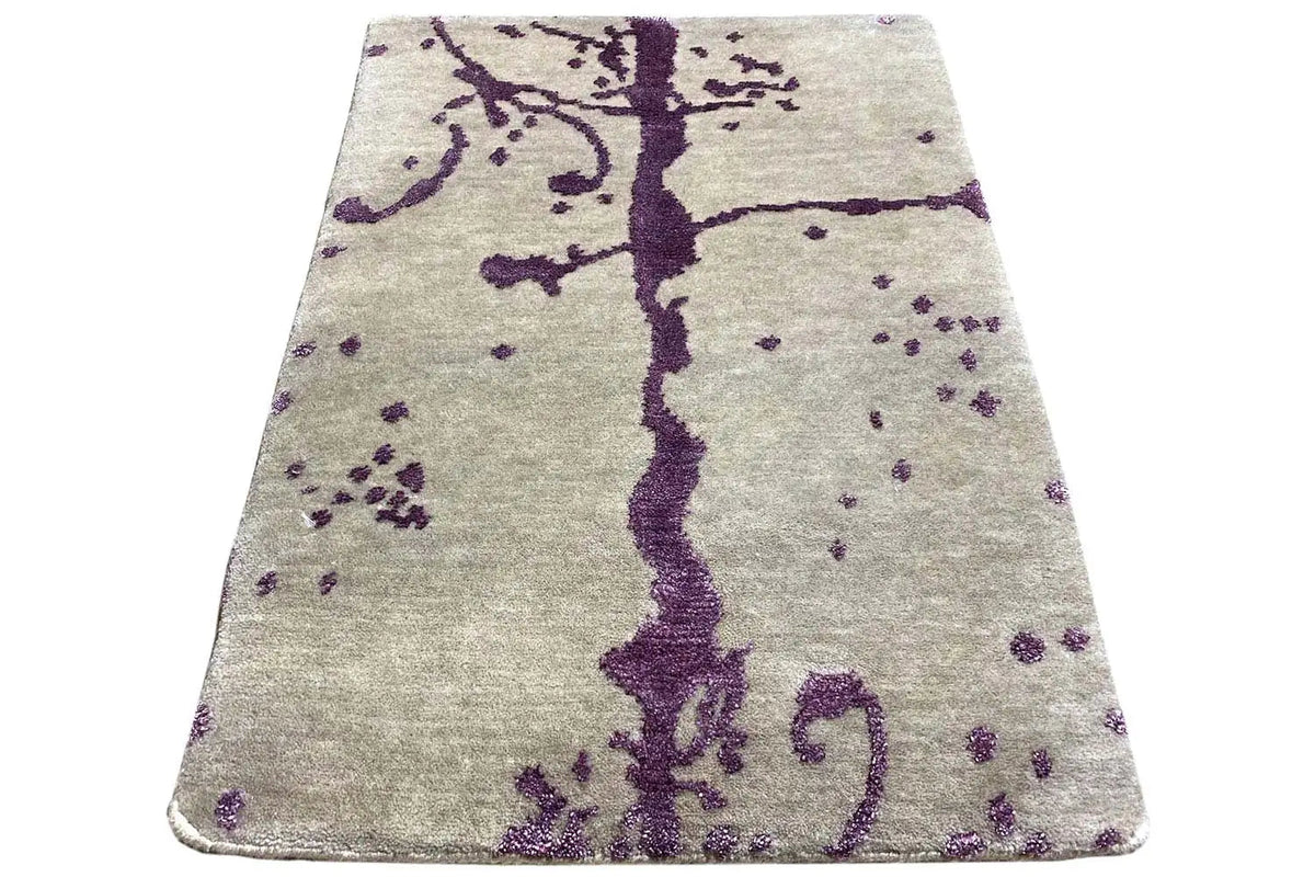 Designer rug with a purple vine pattern, rectangular with rounded corners