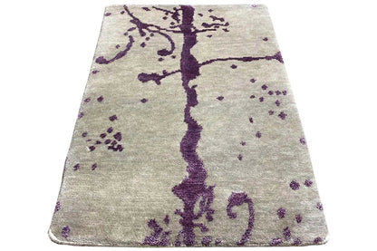 Designer rug with a purple vine pattern, rectangular with rounded corners
