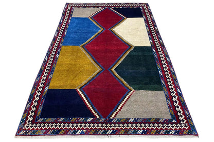 Flat-weave rug with diamond patterns and a contrasting border in red and blue