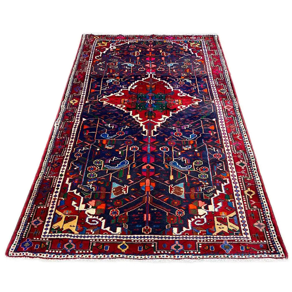 Rectangular Hamadan rug with a dark blue background and red-blue ornaments.