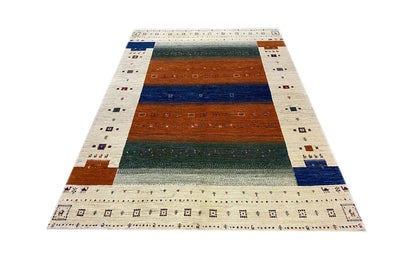 Gabbeh rug front view, wide stripes in blue, brown, and green