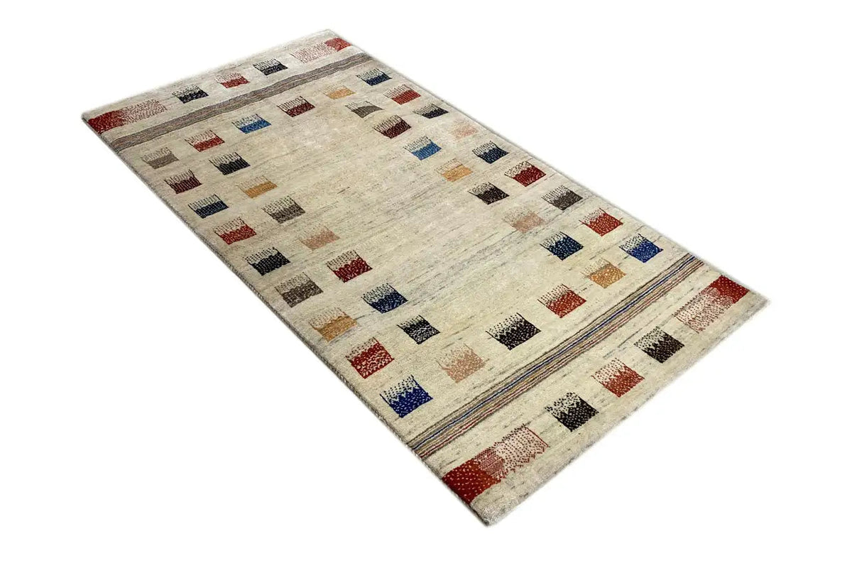 Gabbeh rug with a beige base and colorful tile patterns, wide border