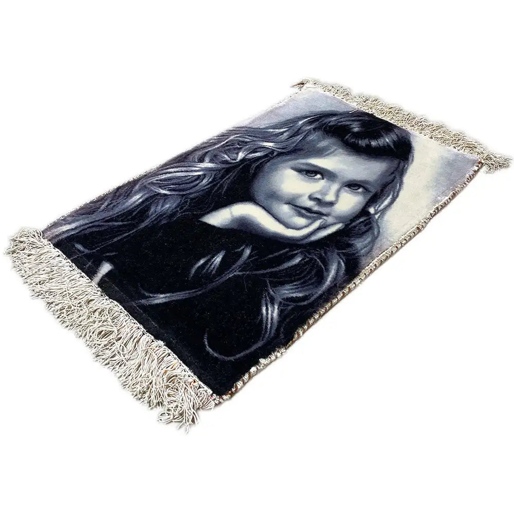 Tapestry at an angle, portrait of a girl, rectangular, with fringes along the edges.