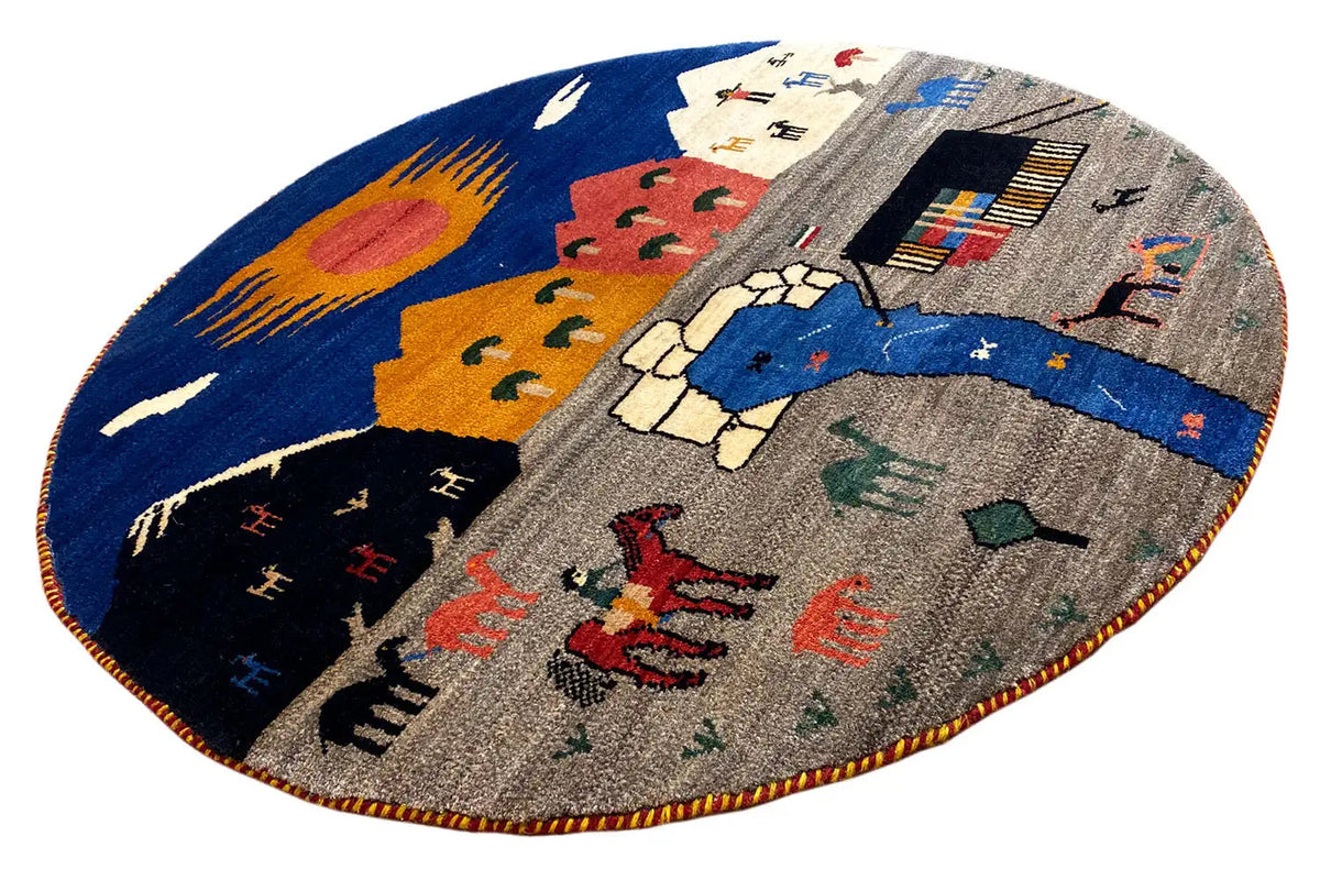 Round Gabbeh rug with a colorful scene motif and colorful border along the edge