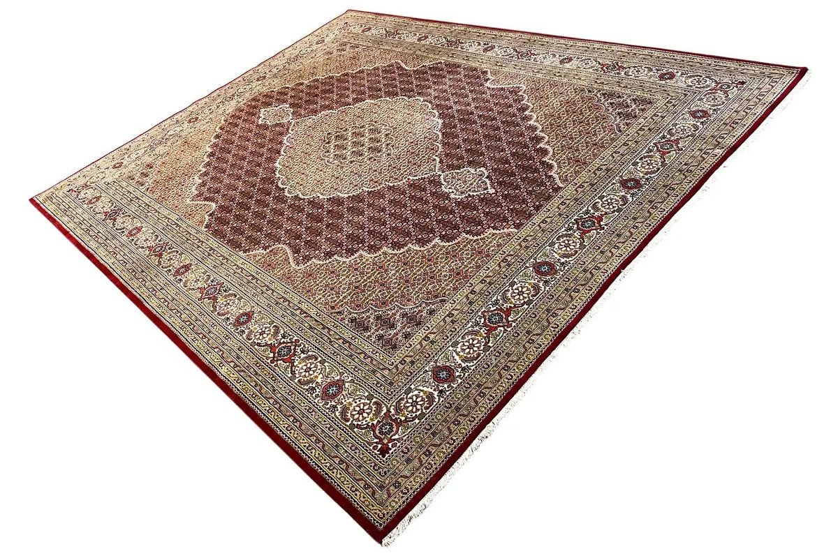Brown rug with a rectangular pattern and decorative borders, diagonal view