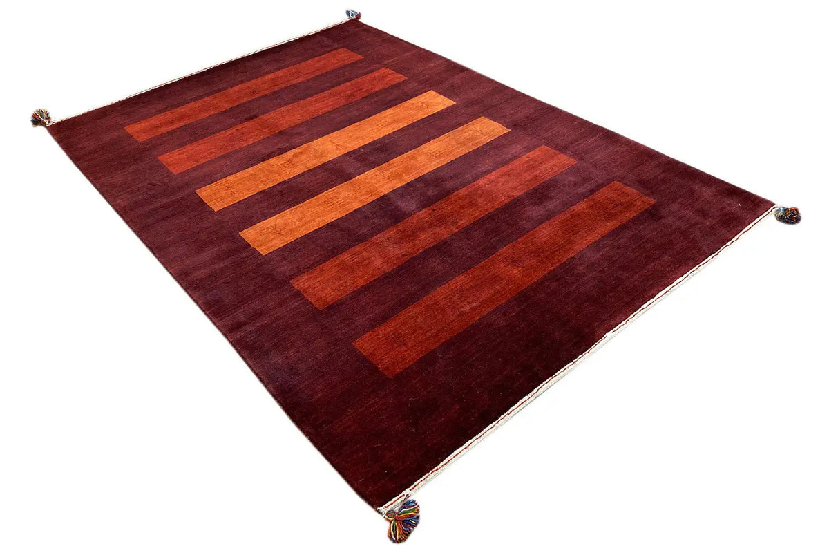 Gabbeh rug, dark red, with stepped orange rectangular stripes and tassels