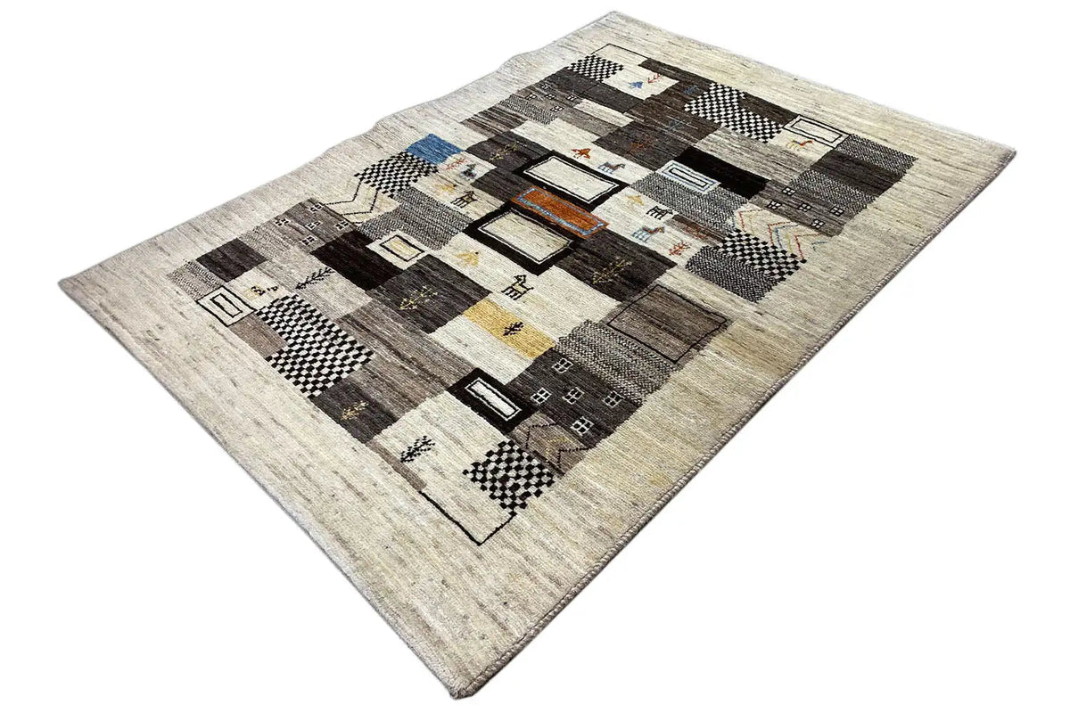 Gabbeh rug with a geometric checkered pattern in beige, black, and gray