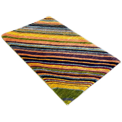 Gabbeh rug with a striped pattern in blue, yellow and green, laid diagonally