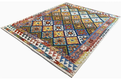 Afghan kilim rug in oblique view with multicolored squares and borders