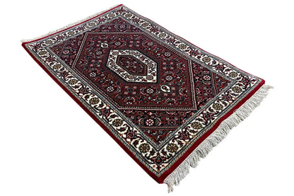 Bidjar rug 94x61 cm in a diamond layout: dark red pattern with light decorative lines