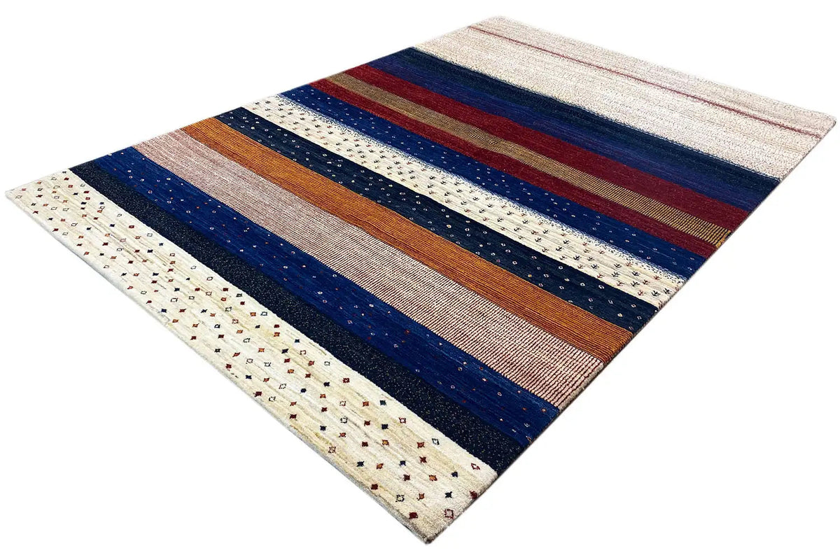 Gabbeh rug in diagonal view: broad stripes in blue, red, and brown on cream