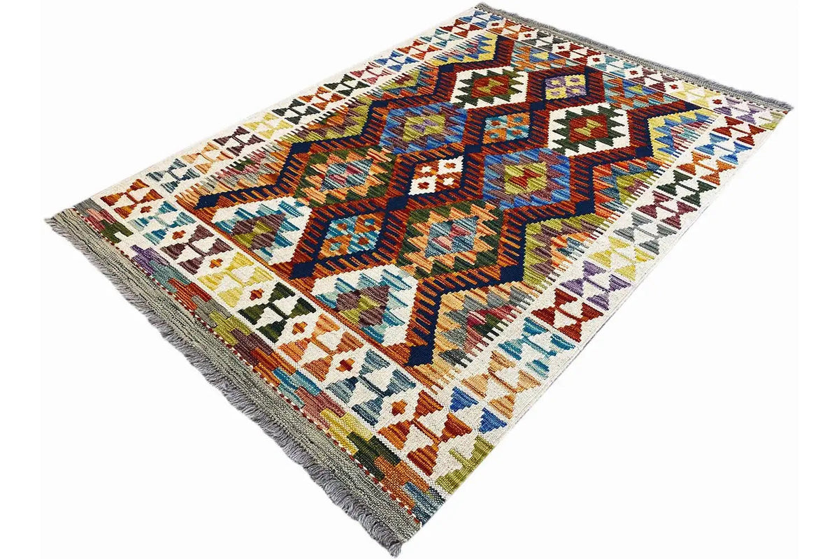 Kilim rug with diagonal zigzag shapes, colorful blocks of color, and fringed sides