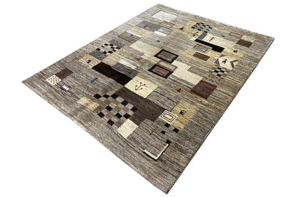 Rectangular rug with a large-scale pattern in gray-beige, black, and brown