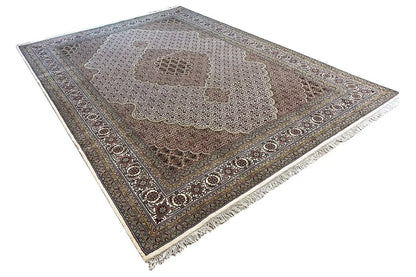 Indo Tabriz rug in corner view with border and fringes