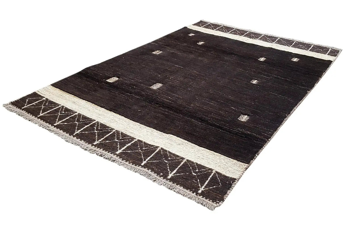 Dark brown Gabbeh rug with a wide beige central border and graphic edge patterns