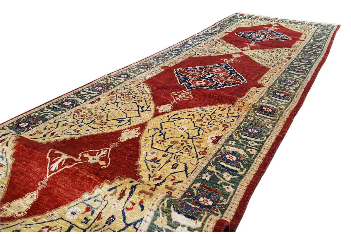 Oriental rug, diagonal close-up: red field with yellow medallions